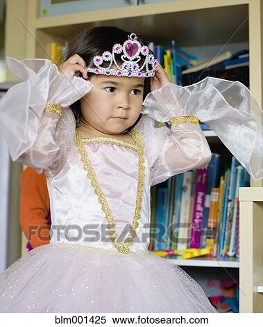 Stock Photography - Asian girl dressing up in princess costume. Fotosearch