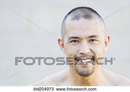 Stock Image - Asian man smiling. Fotosearch