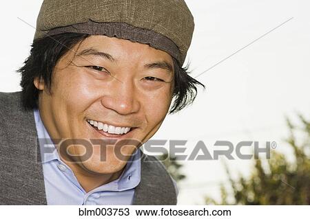 Asian man smiling View Large Photo Image Stock Image - Asian man smiling. Fotosearch