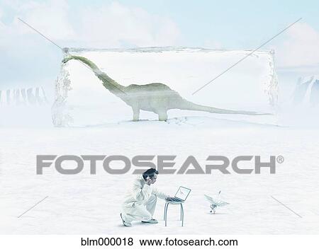 Asian man with laptop in front of dinosaur frozen in ice View Large Photo Image Stock Photo - Asian man with laptop in front of dinosaur frozen in ice. Fotosearch