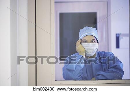 Asian medical professional leaning chin on hand View Large Photo Image Stock Image - Asian medical professional leaning chin on hand. Fotosearch