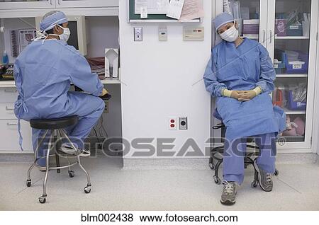 Asian medical professionals sitting on stools View Large Photo Image Stock Photo - Asian medical professionals sitting on stools. Fotosearch