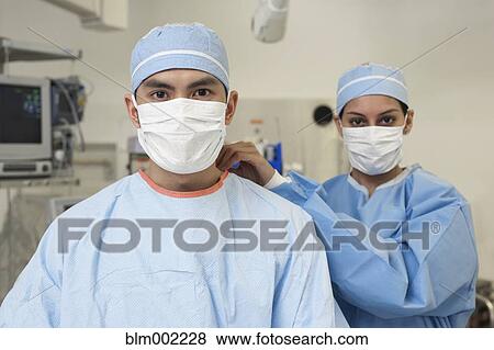 Stock Photo - Asian medical professionals wearing surgical masks. Fotosearch