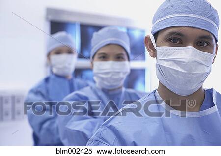 Asian medical professionals wearing surgical masks View Large Photo Image Stock Photography - Asian medical professionals wearing surgical masks. Fotosearch
