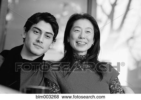Asian mother smiling with son View Large Photo Image Stock Photo - Asian mother smiling with son. Fotosearch
