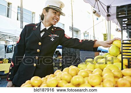 Asian soldier shopping in farmers market View Large Photo Image Stock Photograph - Asian soldier shopping in farmers market. Fotosearch
