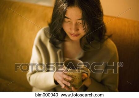 Asian woman drinking tea View Large Photo Image Stock Image - Asian woman drinking tea. Fotosearch