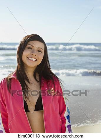 Stock Photo - Asian woman in front of ocean. Fotosearch