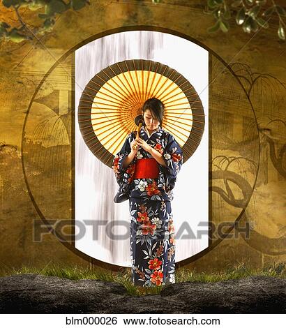 Asian woman in geisha dress holding parasol View Large Photo Image Stock Photograph - Asian woman in geisha dress holding parasol. Fotosearch
