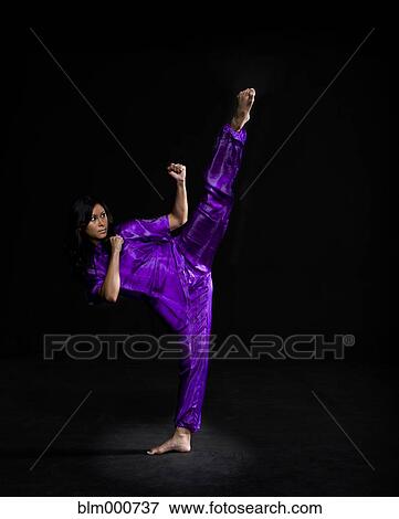Stock Photo - Asian woman practicing martial arts. Fotosearch
