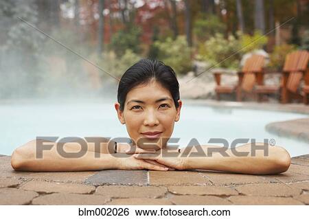 Asian woman sitting in hot tub View Large Photo Image Stock Photograph - Asian woman sitting in hot tub. Fotosearch