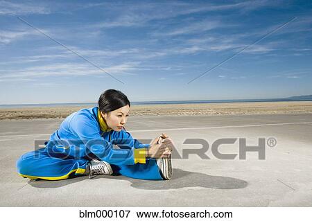 Asian woman stretching View Large Photo Image Stock Photo - Asian woman stretching. Fotosearch