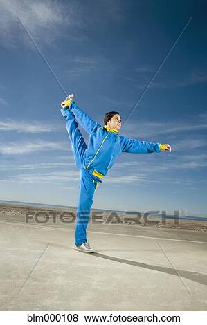 Asian woman stretching View Large Photo Image Stock Photo - Asian woman stretching. Fotosearch