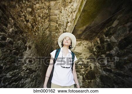 Asian woman walking in tunnel View Large Photo Image Stock Image - Asian woman walking in tunnel. Fotosearch