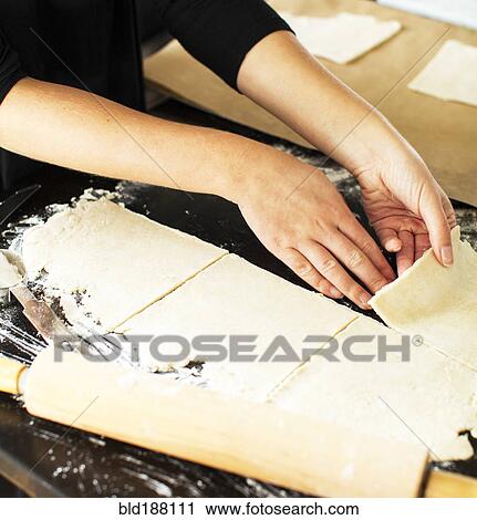 Baker cutting pie dough View Large Photo Image Stock Image - Baker cutting pie dough. Fotosearch