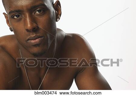 Picture - Bare chested African man. Fotosearch