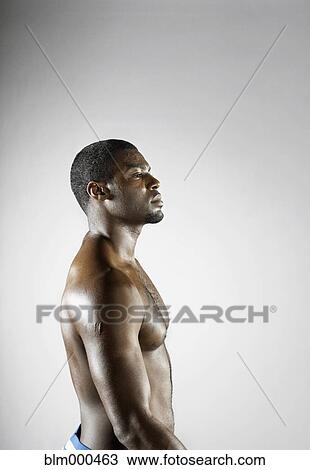 Stock Image - Bare chested African man. Fotosearch