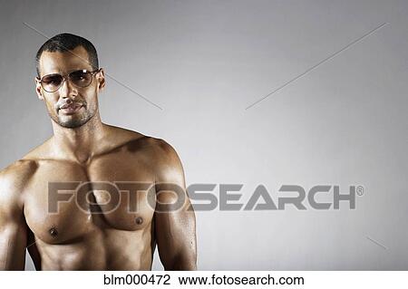 Bare chested mixed race man in sunglasses View Large Photo Image Stock Image - Bare chested mixed race man in sunglasses. Fotosearch