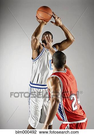 Basketball player trying to take basketball from opponent View Large Photo Image Stock Image - Basketball player trying to take basketball from opponent. Fotosearch