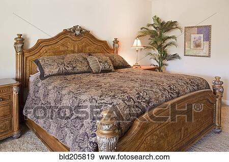Stock Photo - Bed in bedroom. Fotosearch