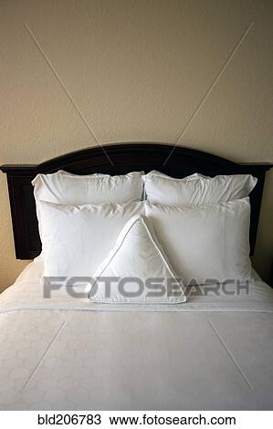 Stock Image - Bed in Hotel Room. Fotosearch