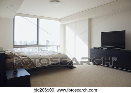 Bedroom in luxury highrise apartment View Large Photo Image Stock Image - Bedroom in luxury highrise apartment. Fotosearch