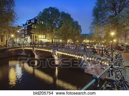 Picture - Bicycles Parked on Bridge Over Canal. Fotosearch