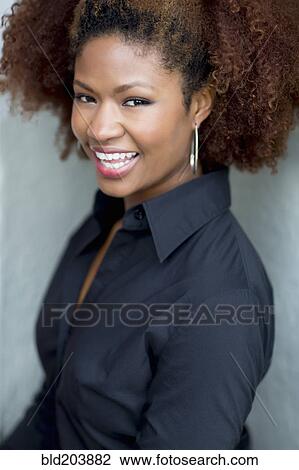 Stock Image - Black businesswoman smiling. Fotosearch