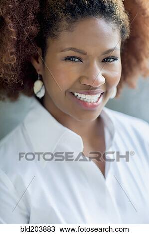 Stock Image - Black businesswoman smiling. Fotosearch