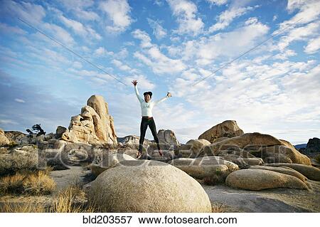 Stock Photo - Black runner in desert landscape, Joshua Tree National Park, California, United States. Fotosearch