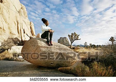 Stock Photography - Black runner in desert landscape, Joshua Tree National Park, California, United States. Fotosearch