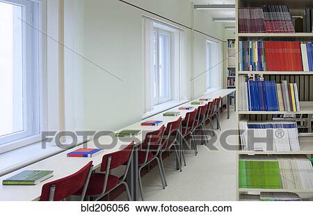 Stock Photograph - Books on long table in library. Fotosearch
