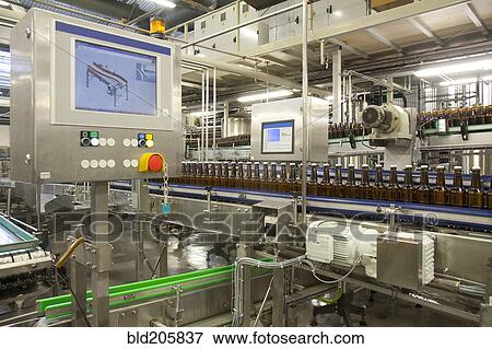 Stock Photo - Bottles on production line in bottling plant. Fotosearch