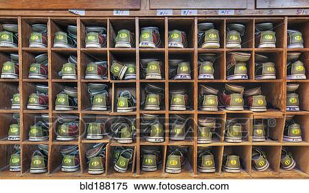 Stock Photography - Bowling shoes stacked in cabinet. Fotosearch