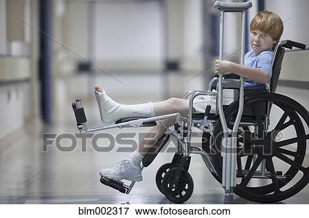 Boy with cast in wheelchair View Large Photo Image Stock Photo - Boy with cast in wheelchair. Fotosearch