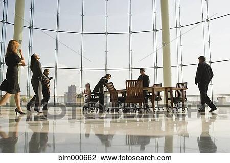 Stock Image - Business people in conference room for meeting. Fotosearch
