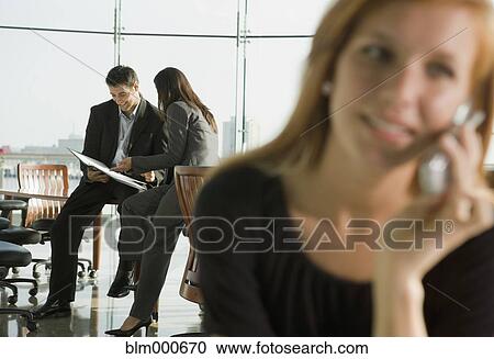 Stock Image - Business people in conference room for meeting. Fotosearch