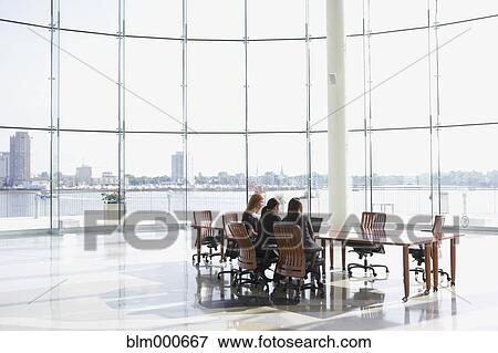 Stock Photo - Business people in conference room for meeting. Fotosearch