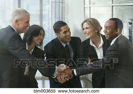 Business people in huddle View Large Photo Image Stock Photography - Business people in huddle. Fotosearch