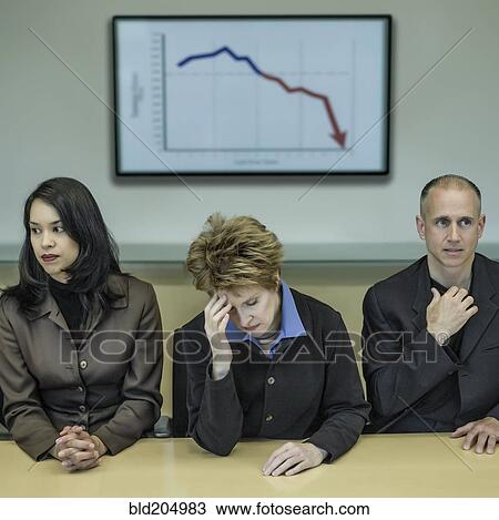 Stock Image - Business people sitting in meeting. Fotosearch