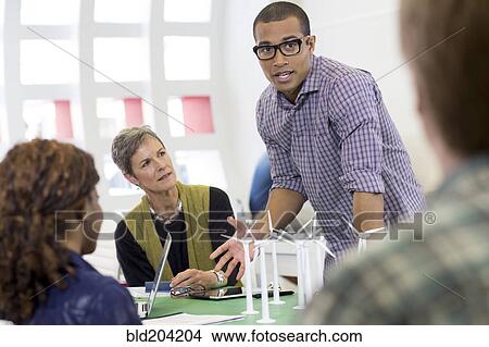 Picture - Business people talking in meeting. Fotosearch