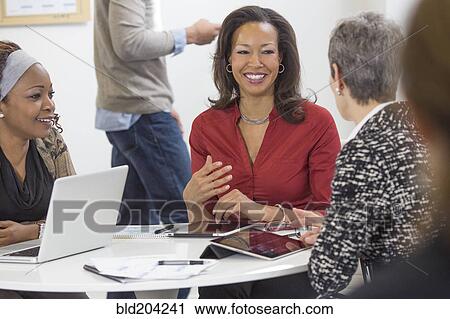 Business people talking in meeting View Large Photo Image Stock Image - Business people talking in meeting. Fotosearch