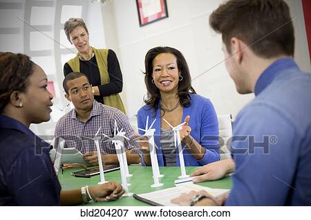 Stock Photo - Business people talking in meeting. Fotosearch