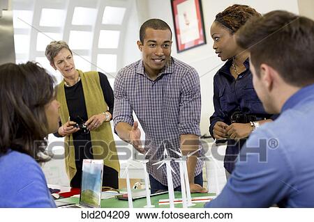 Stock Photo - Business people talking in meeting. Fotosearch