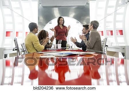 Stock Photograph - Business people talking in meeting. Fotosearch