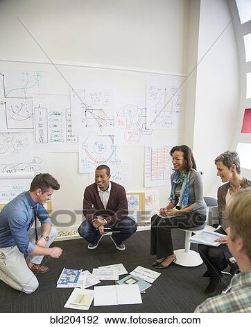Business people talking in office View Large Photo Image Stock Image - Business people talking in office. Fotosearch