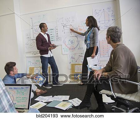 Business people talking in office View Large Photo Image Stock Image - Business people talking in office. Fotosearch