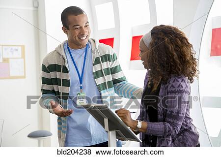 Business people talking in office View Large Photo Image Stock Photo - Business people talking in office. Fotosearch
