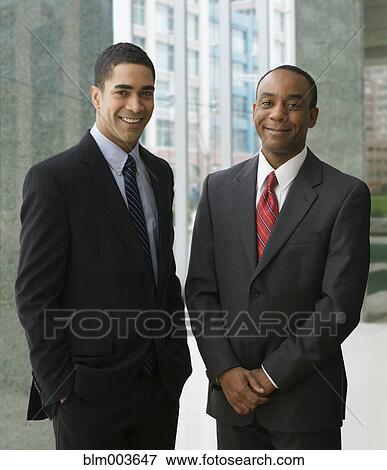 Stock Photo - Businessmen smiling. Fotosearch