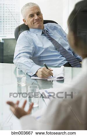 Stock Photo - Businessmen talking. Fotosearch